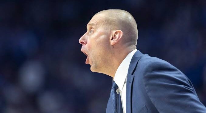 Referee stops game to stare down Mark Pope, who clearly was not happy with the officiating